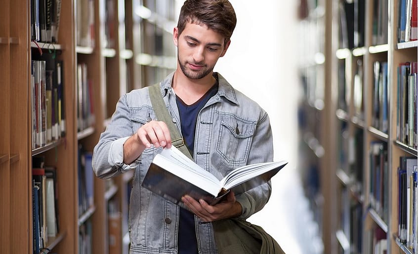 a student checking a book