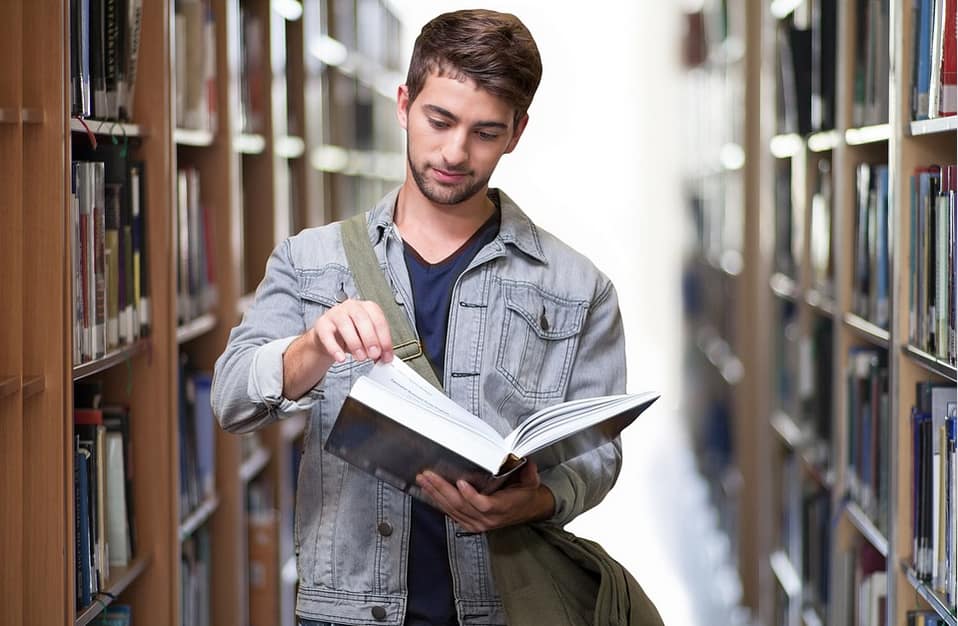 a student checking a book